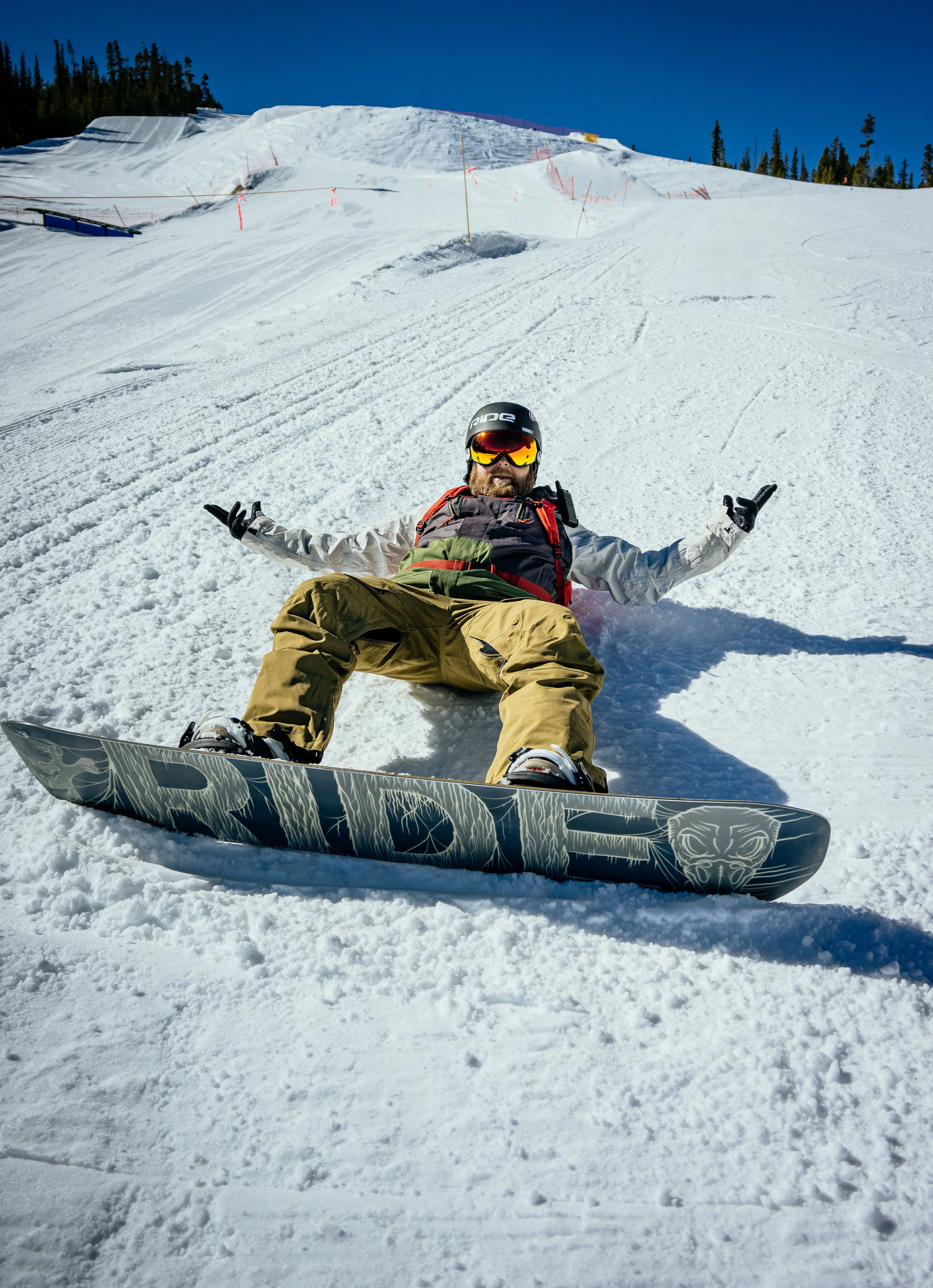 Snowboarder laying in the snow