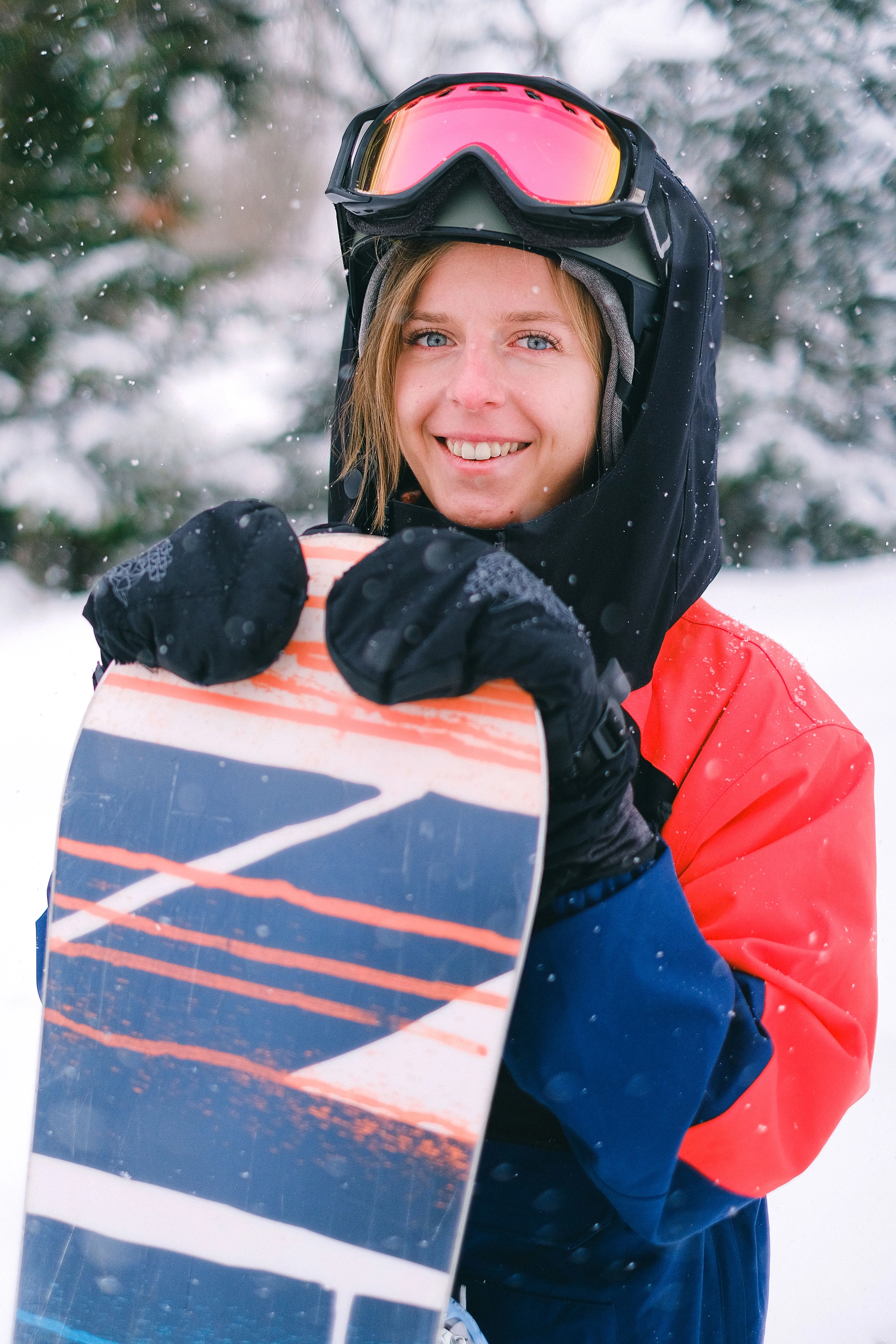 Woman holding a snowboard